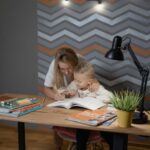 woman helping child with learning, mom and son, woman and child