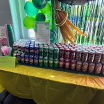 Dirty soda bar setup with a variety of canned drinks for staff appreciation week